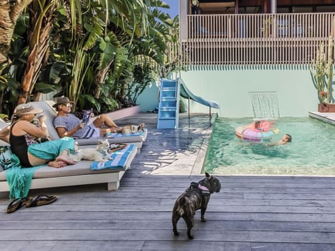 Relax soak up the pool deck surrounded by native and tropical garden 