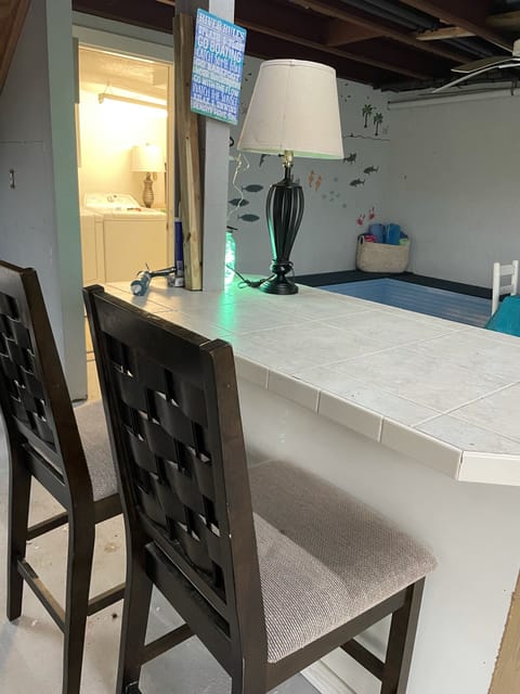 Laundry & screened area under the house to enjoy the river without mosquitoes