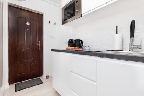 A functional kitchenette that provides a comfortable space for preparing your favourite meals.