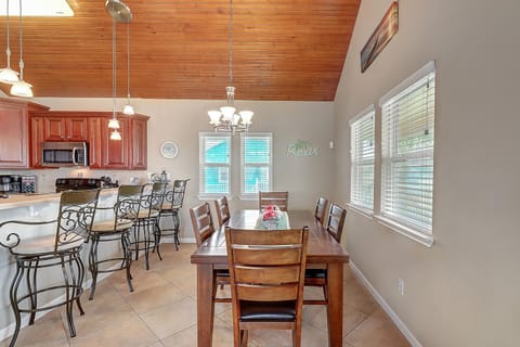 2nd Floor - A bright, open kitchen and dining space with a roomy island, perfect for family time or easy beach-day bites