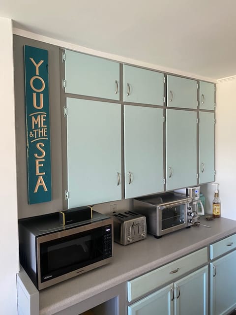 Brand new small appliances. Microwave, toaster, toaster oven, coffee maker.