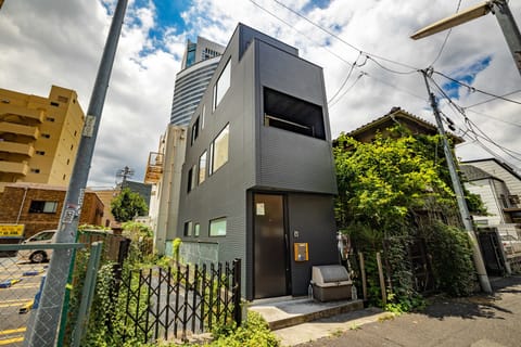 Your serene urban retreat—nestled between greenery and city convenience in uniquely modern exterior