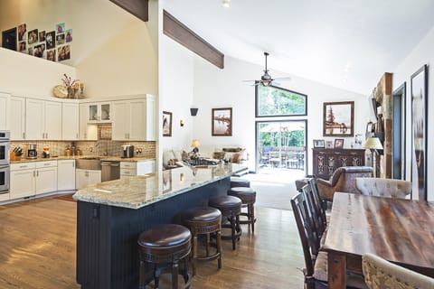 Beautiful kitchen island with bar seating for 5 and second dining table.