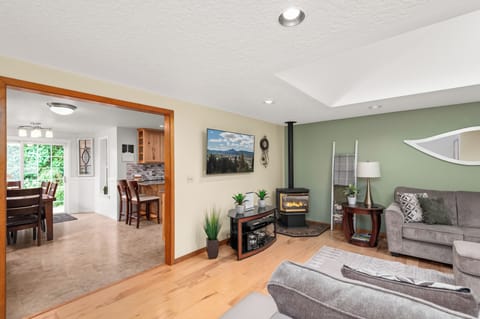 Comfortable living room with a Smart TV Dish Satelite, and a gas fireplace.