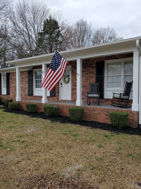 Cozy front porch with rocking chairs.