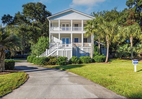Beautiful coastal home with spacious porches and a welcoming driveway