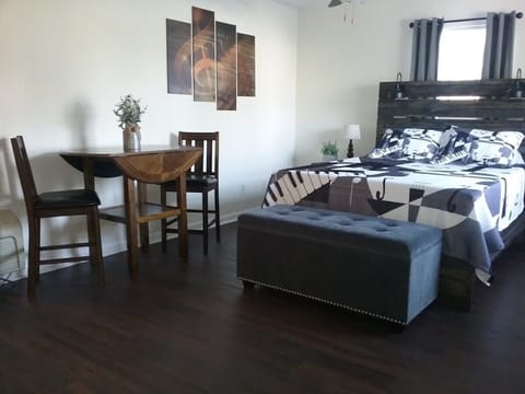 Queen Bed and High top table with 2 Stool Chairs