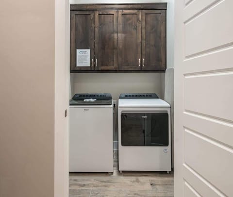 Laundry room with washer and dryer provided