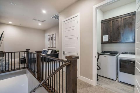 House #50 upstairs family room and laundry room