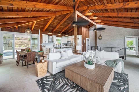 Chic island living meets modern comfort in this open-concept gathering space.