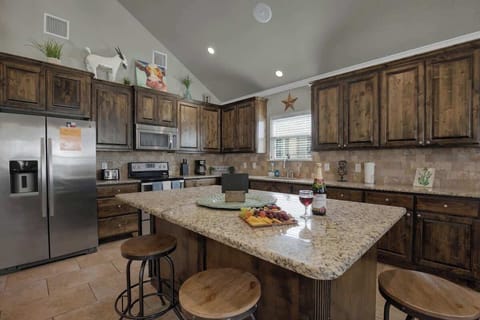 Spacious kitchen with island seating for three.
