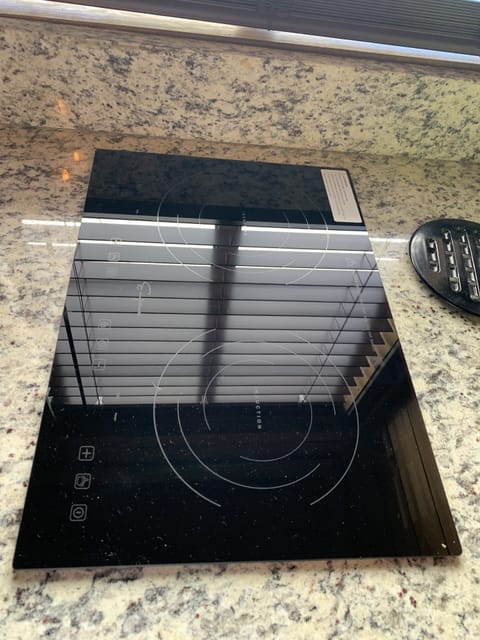 Electric glass cooktop stove built into granit counter