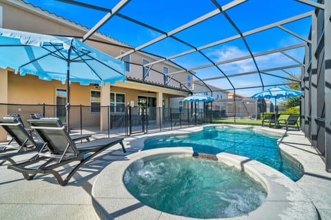 - Private screened pool with hot tub and loungers 
- Safe and secure family area for fun and relaxation outdoors  
- Florida villa near Disney with poolside comfort and dining