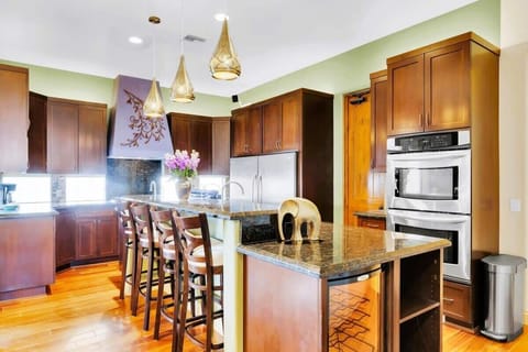 Embracing the charm of wooden cabinets and a cozy center island! This kitchen is not just for cooking; it's a hub for laughter, love, and unforgettable moments. 🏡💖