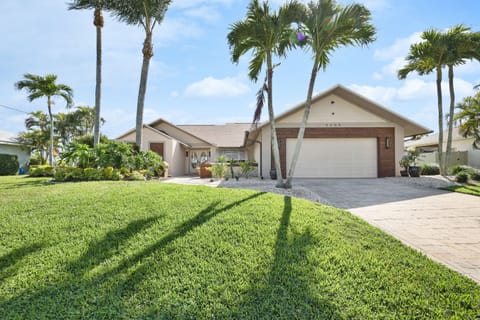 Beautiful remodeled home on wide canal with gorgeous sunrises.