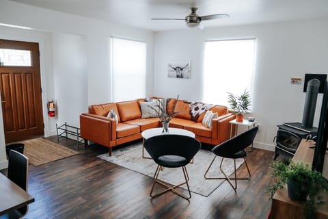 Large, open family room with gas fireplace and 55" TV.