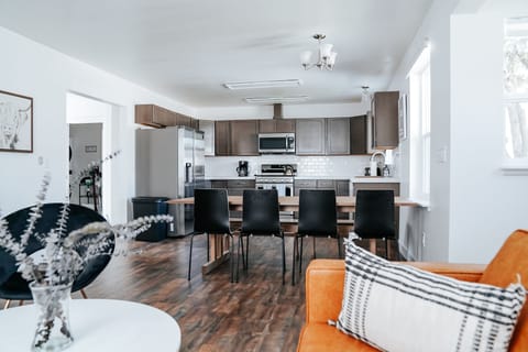 Large, bright, open kitchen, dining and living room space. Table seating for 9.