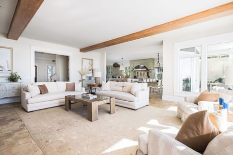 Stylish seating area with abundant sunlight and coastal charm