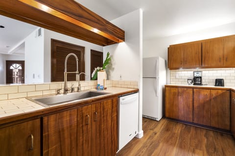 Warm wood finishes and modern upgrades blend function with Hawaiian charm.0