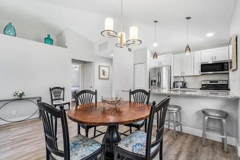 Dining area, bar, and outdoor dining area make it a dream to call home.