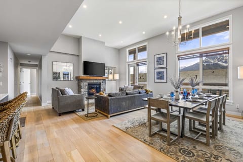Expansive living room with light-filled windows and room for everyone to relax. 🛋️✨