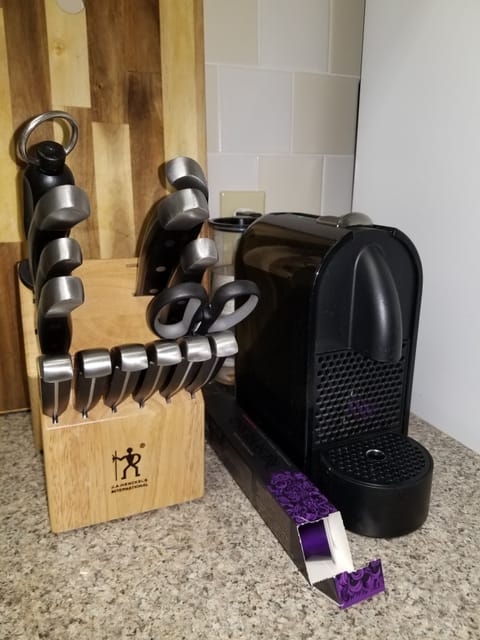 Knives and Nespresso coffee machine