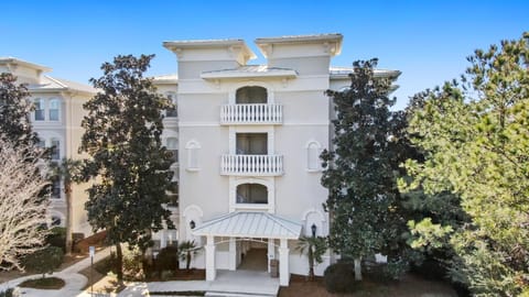 Mediterranean stucco building with only 8 units total —two per floor