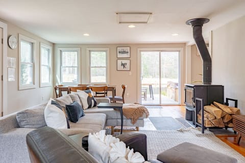 Open floor plan with living/dining room and access to back deck