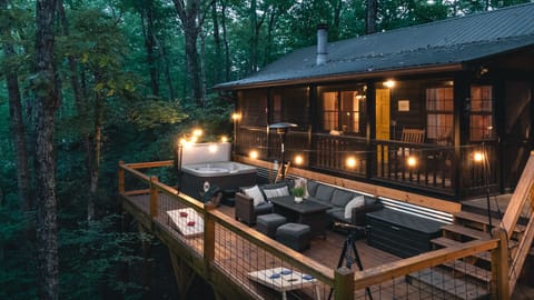 Relax under the trees on the large outdoor deck
