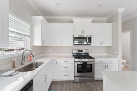 Fully equipped kitchen with all cooking and baking supplies, gas stove, and dishwasher. Grill tools available for outdoor grill. Dining area seats 6 with 4 at the table and 2 at kitchen island. Regular drip coffee maker.