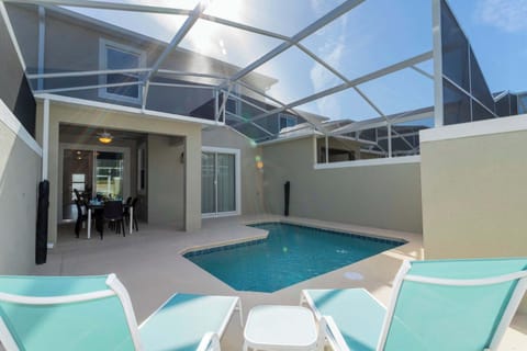 Soak up the sun in your own private oasis! This screened-in patio features a refreshing splash pool and comfortable lounge chairs for ultimate relaxation.