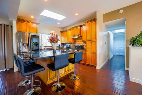 Kitchen and island with chairs for four