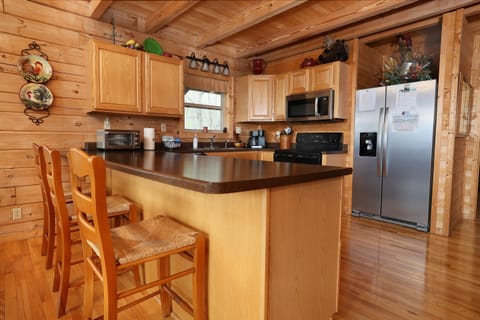 Kitchen with island seating for 3