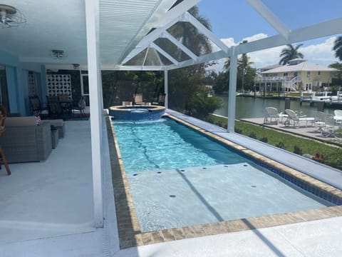 Saltwater pool and spa overlooking the direct access to gulf canal 