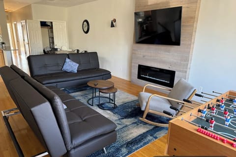 Wide open living room w/ smart TV and Cozy fireplace