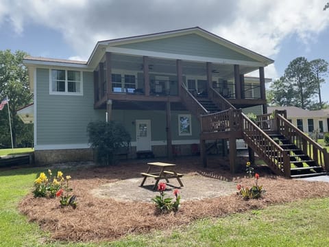 Lakeside of house. Upstairs porch is perfect for dining and viewing lake!