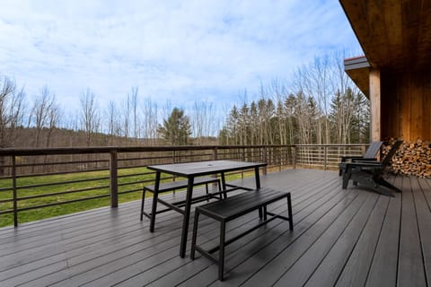 Outdoor patio with Adirondack chairs and table