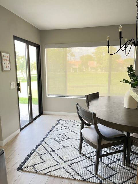 Dinning room off the Kitchen with views of the golf course. 