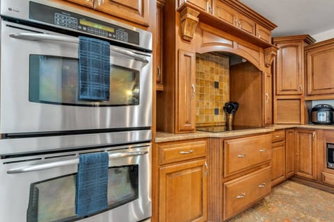 Well-appointed kitchen with double ovens and generous prep space, designed for family dinners and holiday-style gatherings.