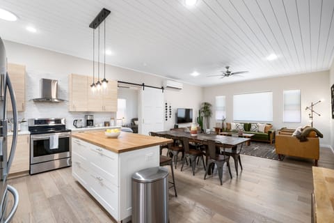 {Kitchen} Open-concept kitchen + dining room with seating for 8.