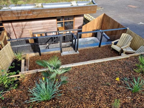 The terraced garden area to the rear is accessed via steps from the back door