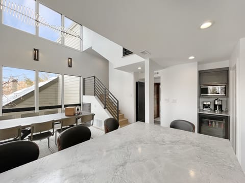 The ultimate coffee and beverage nook: enjoy your choice of a fresh espresso, a classic drip brew, or a perfectly chilled glass of wine from the dedicated cooler.