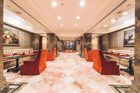 Step into a grand marble lobby glowing with elegance.