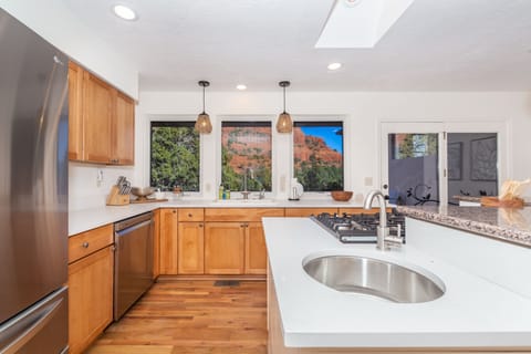 Featuring stunning granite countertops, a large kitchen island, and top-of-the-line appliances, it has everything you need to prepare meals effortlessly.
