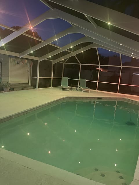 The pool lights at night are beautiful