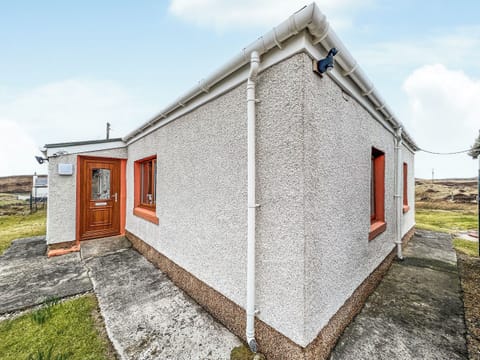 Front door opening into a small porch | Laxdale Cottage, Leverburgh, Isle of Harris