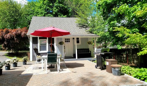 The front door leads to a porch, patio, and small yard. 