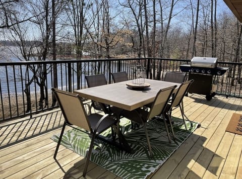 Dining set and Grill on large deck with views of the lake