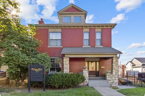 Stunning historic façade with original stone columns and architectural detailing—Holmes Place stands proudly in a walkable neighborhood just minutes from Crown Center and the KC Streetcar.