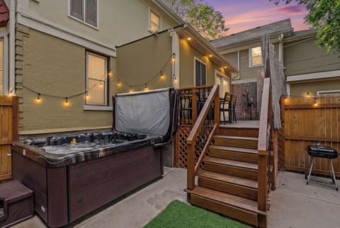 Private courtyard includes outdoor seating and a hot tub!